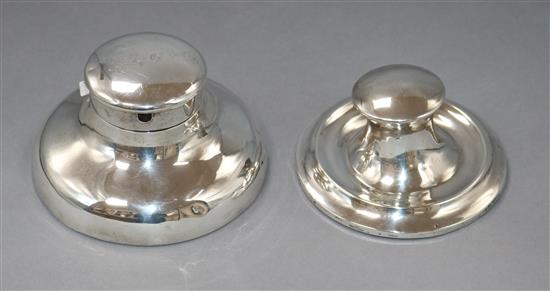 An Edwardian silver capstan inkwell with pocket watch holder lid, Birmingham 1906 diameter 15cm and another later inkwell, 13.5cm